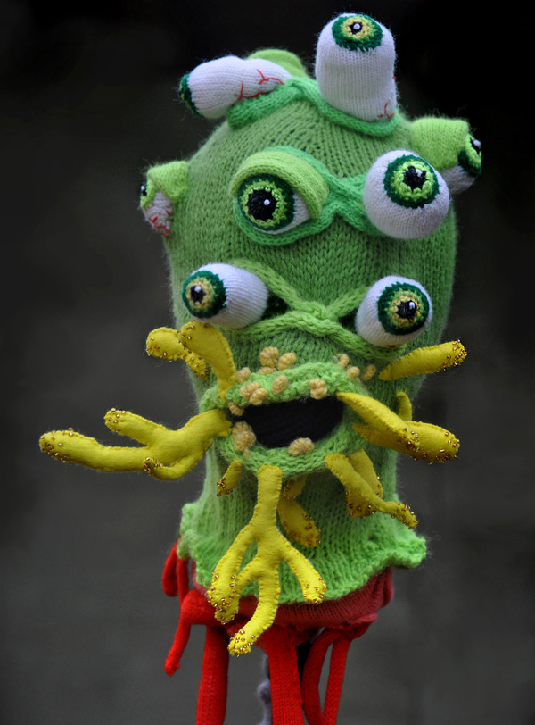 Knitting masks by artist Tracy Widdess